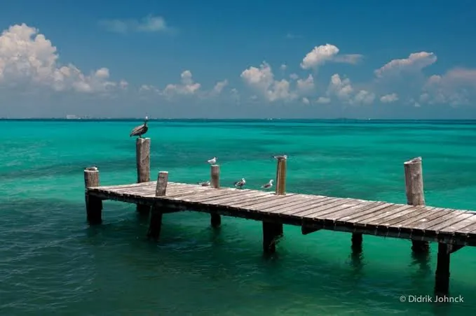 Quiet wooden pier over turquoise water
