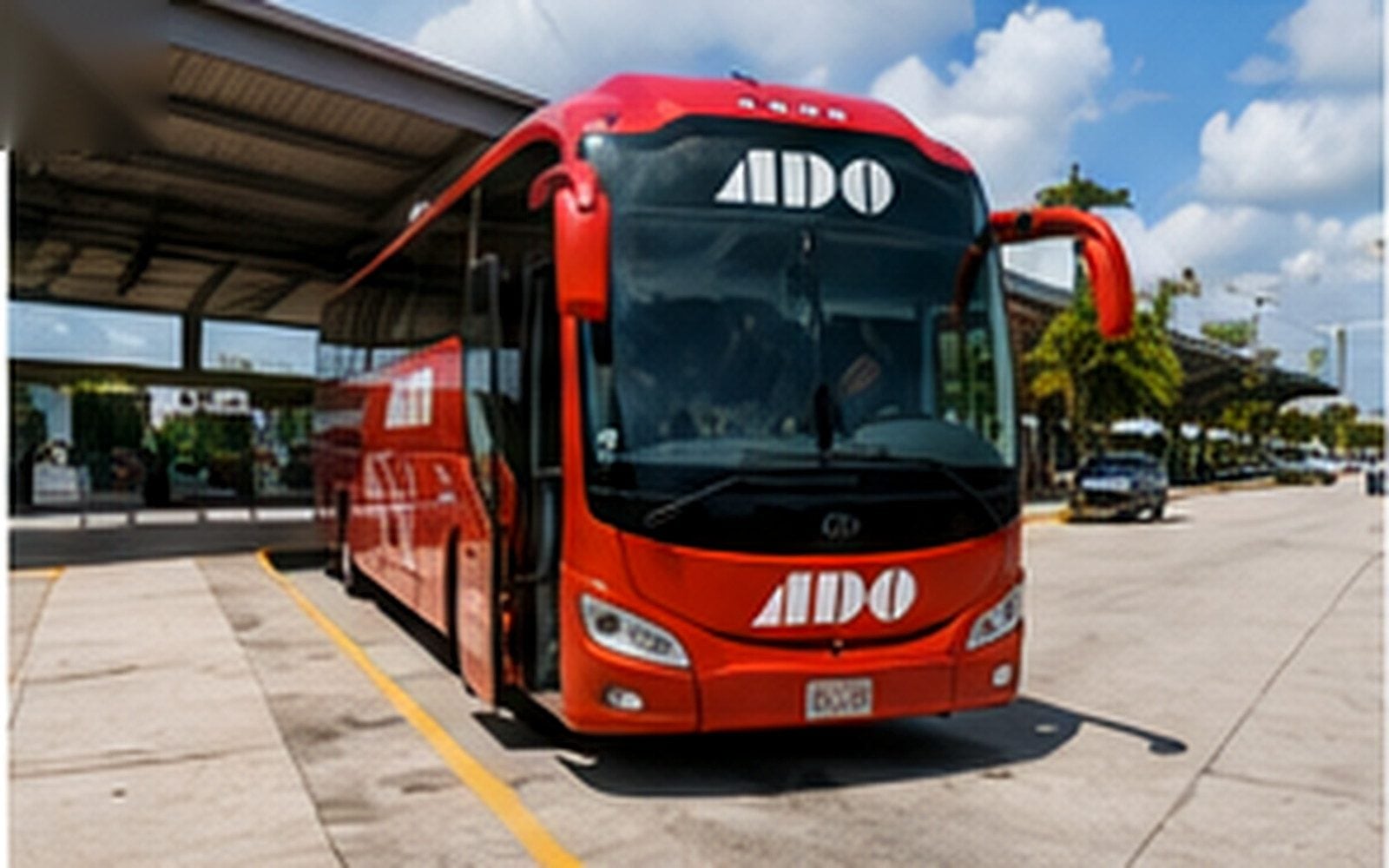 A regional passenger bus at a terminal serving the Cancún and Tulum corridor.