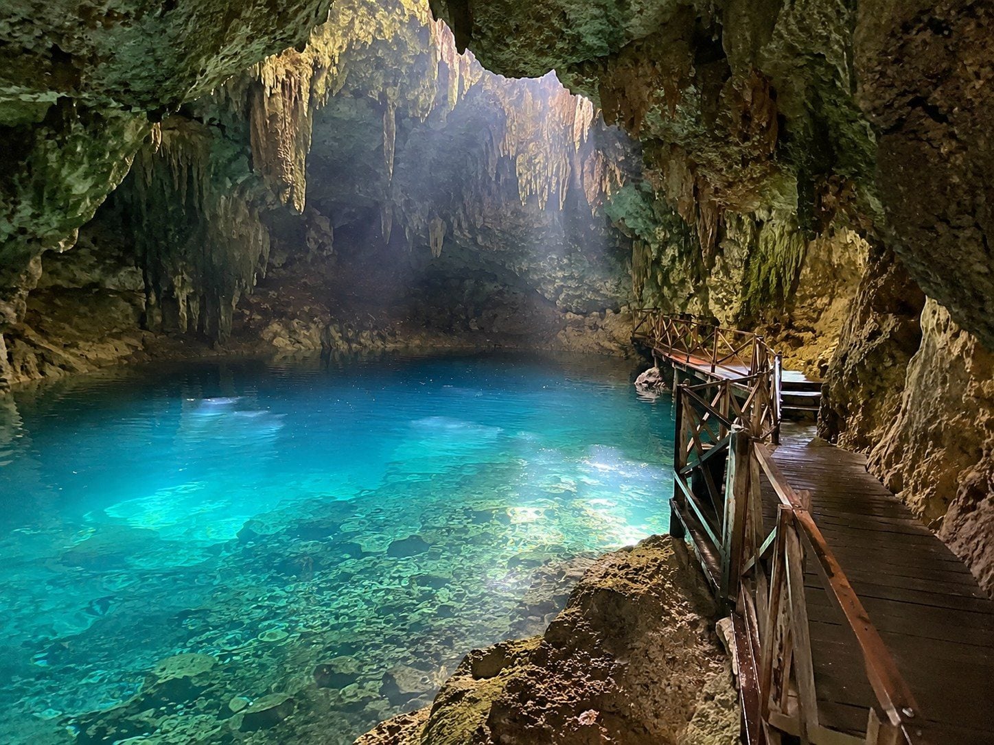 Marked stairs, handrails and life-jacket area at a rural cenote near Valladolid.