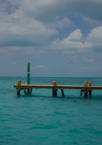Quiet wooden pier extending into the Caribbean at Isla Mujeres