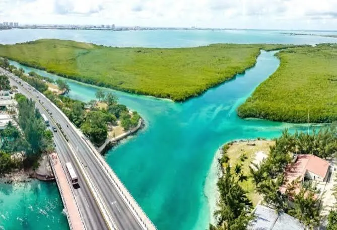 Aerial view of turquoise channels and mangroves in the Laguna Nichupté system in Cancun.