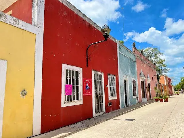 A quiet Valladolid street lined with colorful colonial homes