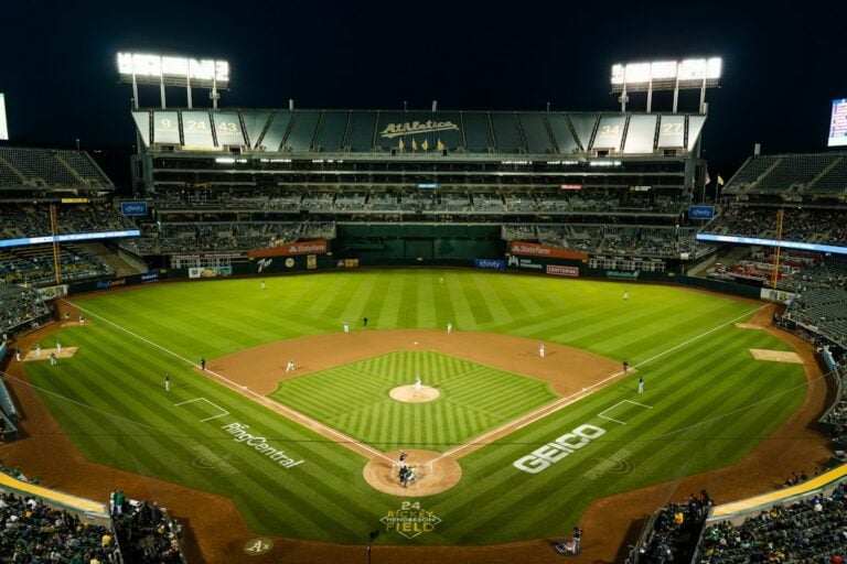 Baseball stadium with a full crowd under stadium lights