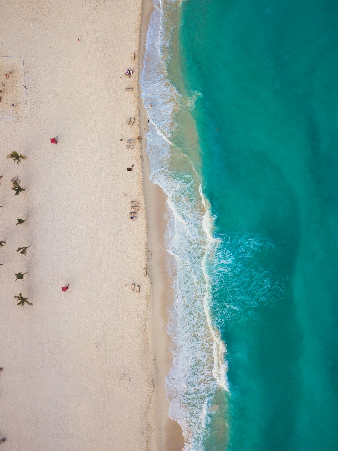 Aerial view of a Cancun beach and bright turquoise Caribbean water