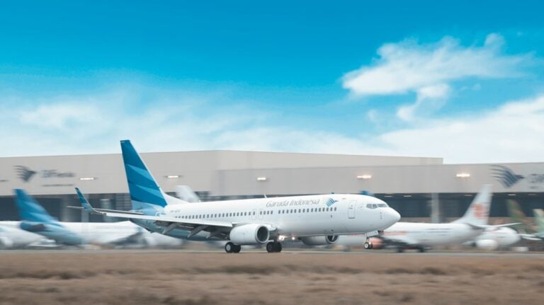 Passenger aircraft approaching an airport runway. Illustrative stock image; not the Miami–Tulum flight or Tulum Airport.